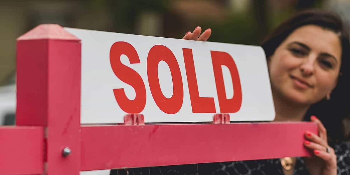 a sold sign in front of a property indicating deceased estate sales