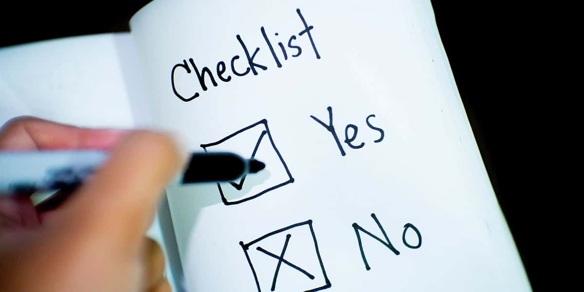a person ticking off items on a checklist to symbolise a probate checklist