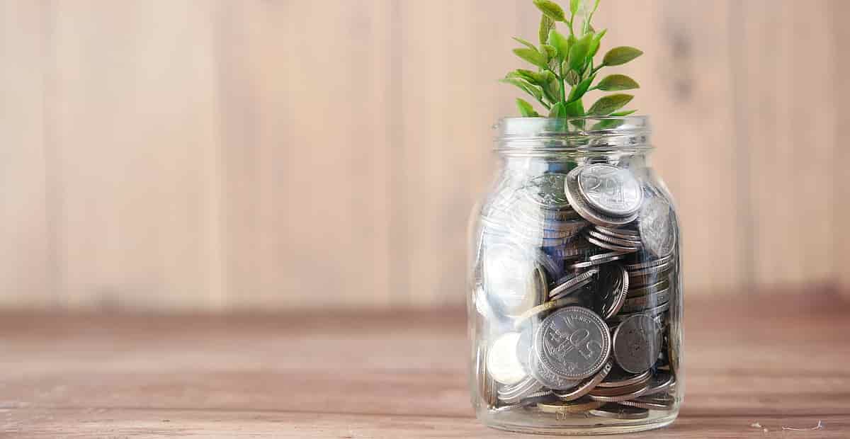 a glas jar filled with coins symbolysing superannuation after death